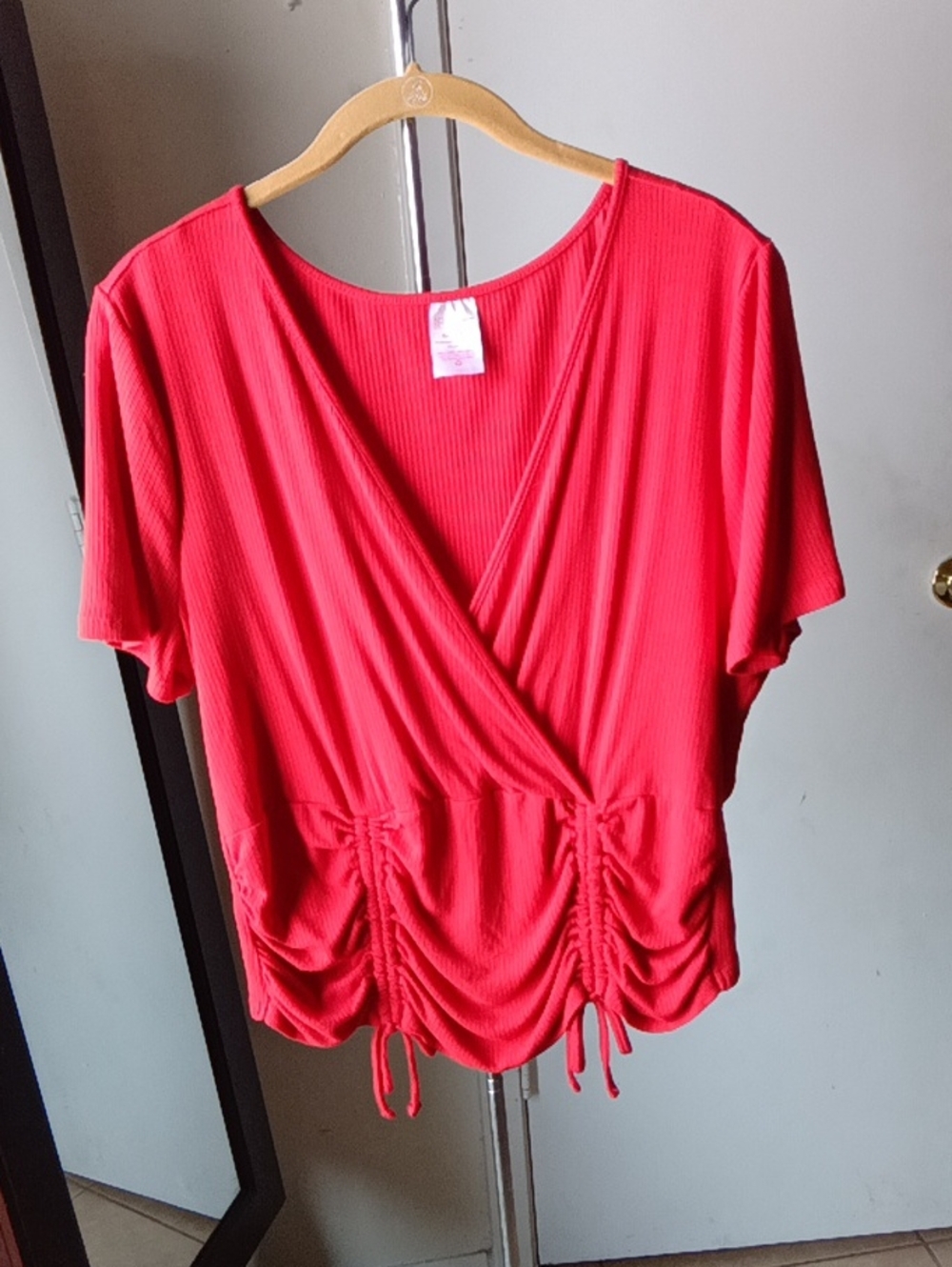 No Boundaries Coral Ribbed Surplice Drawstring Top